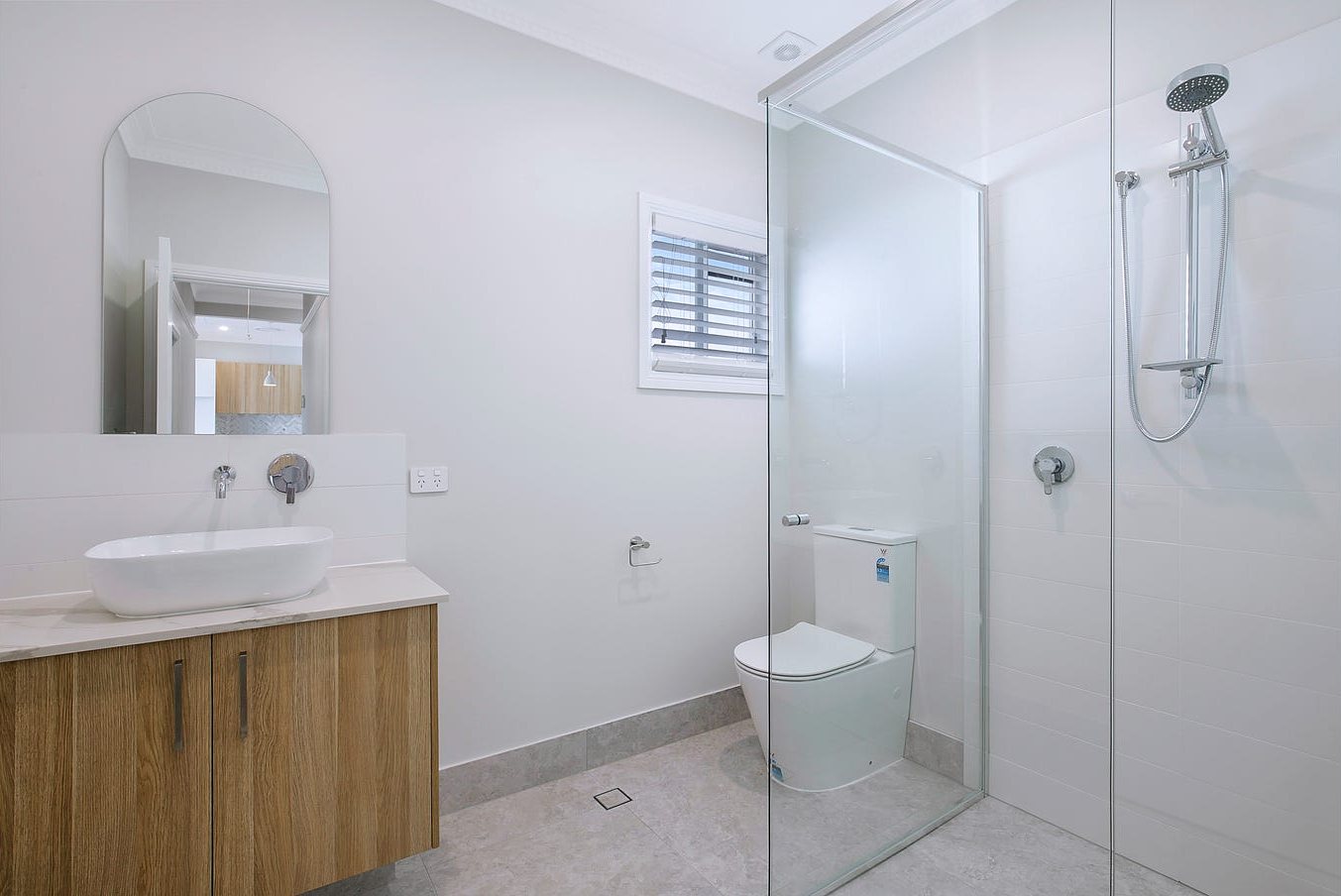 Second bathroom with timber vanity and frameless shower