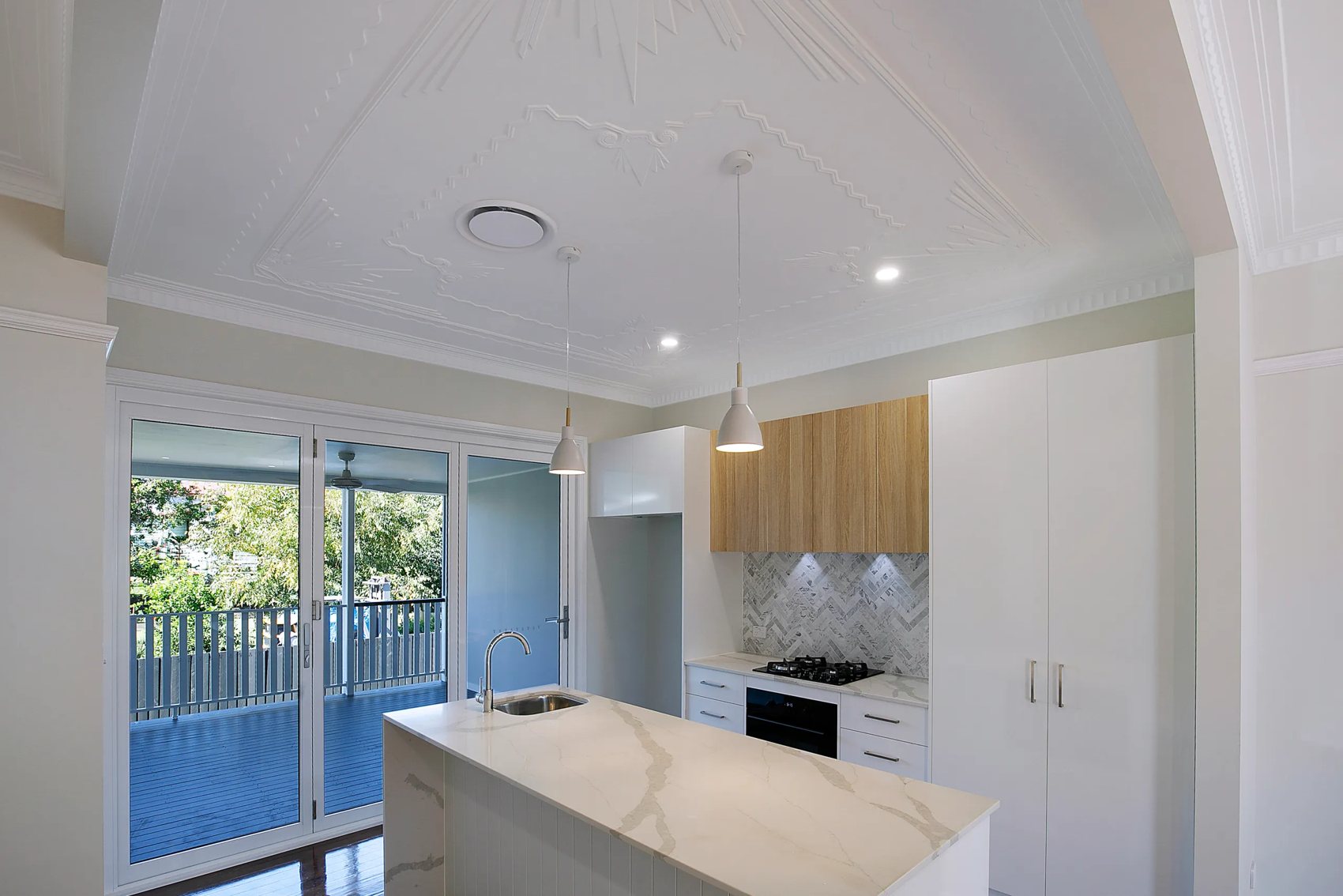 Restored pressed-metal ceiling above the new kitchen