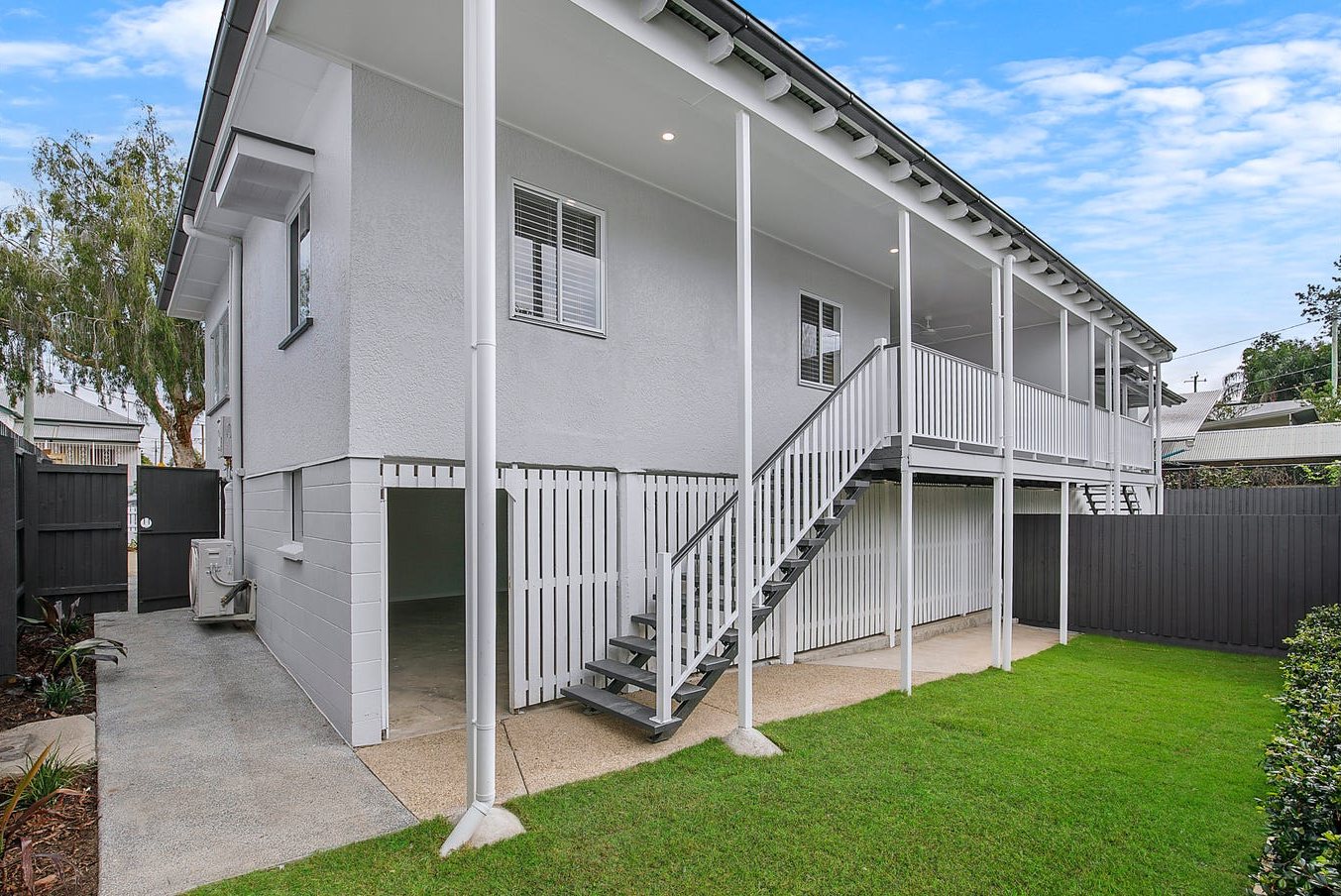 Rear of the house with new stairs, battens and lawn