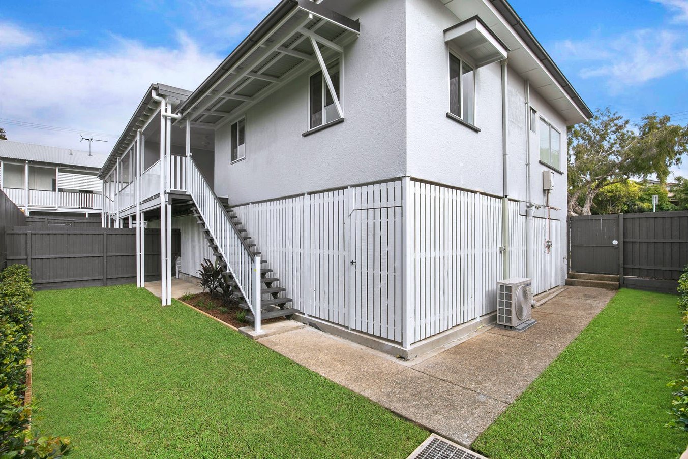 Renovated home with new battens, stairs, fencing and lawn